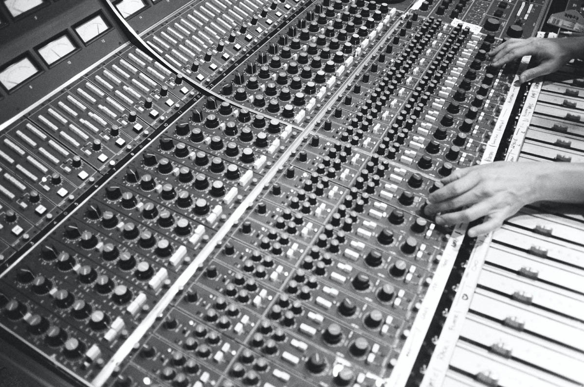 Close-up of Ethan Allen's hands on a mixing console